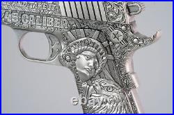 2024 Chad. 45 Caliber Piston Shaped Antiqued 2 oz Silver Coin