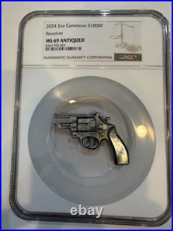 Revolver Mother of Pearl 2024 2 oz Antique Finish Silver Coin Cameroon NGC MS 69 Revolver Mother of Pearl 2024 2 oz Antique Finish Silver Coin Cameroon NGC MS 69